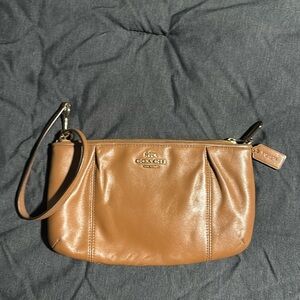 Brown leather Coach wristlet